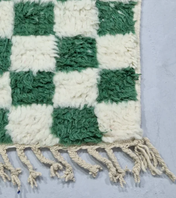 Detailed View of Handmade Moroccan plush wool rug with a green and white checkered pattern
