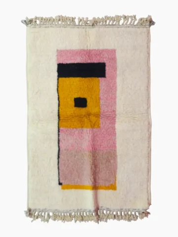 Top View of Elara handmade Beni Ourain wool rug with a colorful block design in vibrant pink, mustard yellow, and charcoal gray