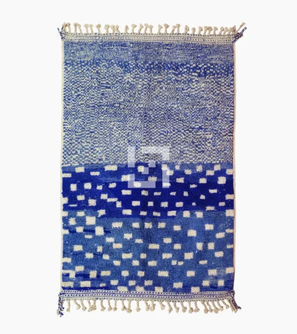 Top View of Handwoven wool rug with a checked abstract pattern on a blue background