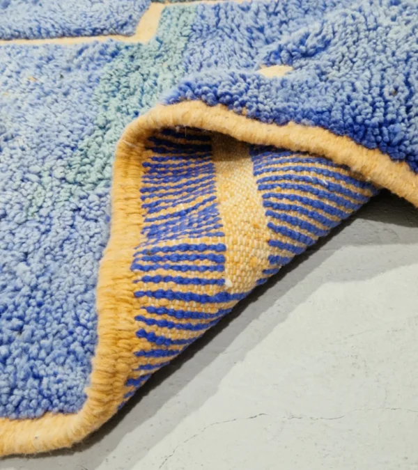 Detailed View of Handmade Beni Mrirt rug with a lined geometric high-low pattern