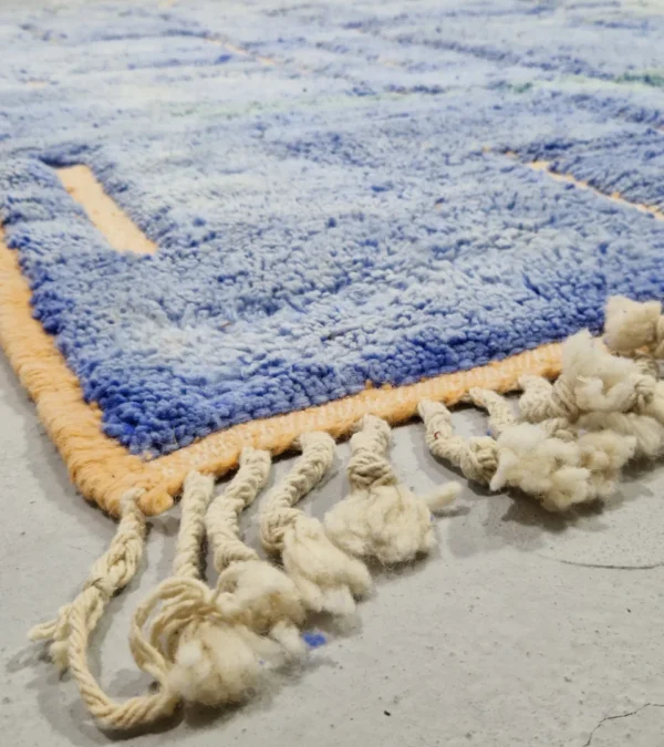Detailed View of Handmade Beni Mrirt rug with a lined geometric high-low pattern