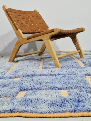 Sky Bleu and Gold Handmade Beni Mrirt rug with a lined geometric high-low pattern in lifestyle setting