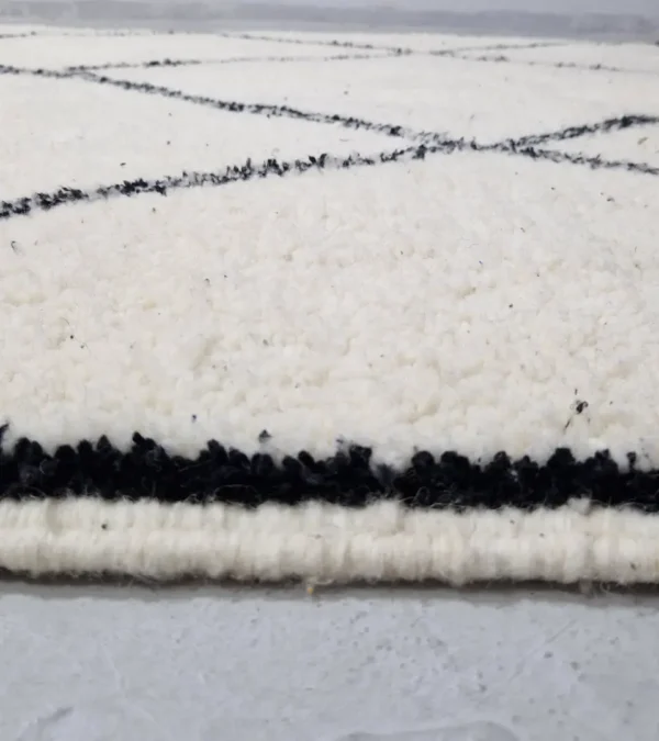 Zoomed In View of Ivory Hand-knotted Beni Ourain Moroccan wool rug with a Black diamond lattice pattern