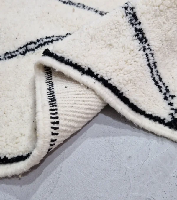 Detailed View of Ivory Hand-knotted Beni Ourain Moroccan wool rug with a Black diamond lattice pattern