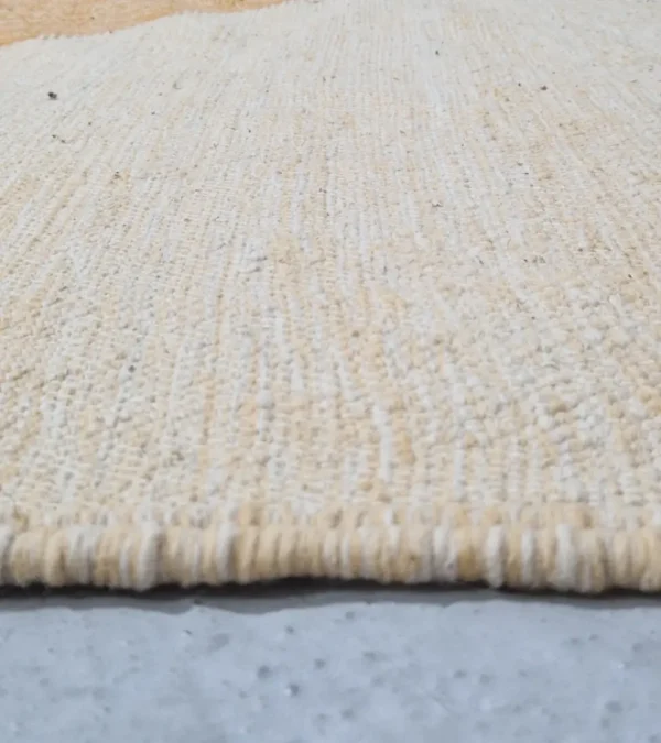 Zoomed in view of Handmade Moroccan Kilim rug with a minimalist diamond pattern