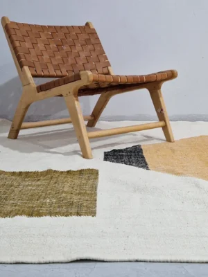 Biege and Orange Diamond Geometric Kilim Rug in wall decorated room