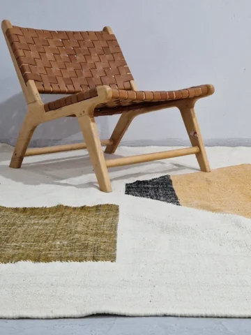 Biege and Orange Diamond Geometric Kilim Rug in wall decorated room