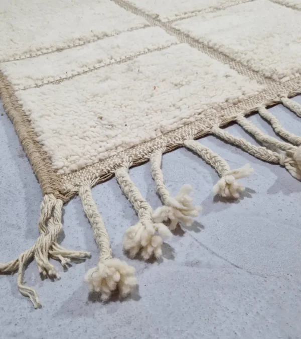 Detailed View of Neutral Handmade Moroccan high-low wool rug with a geometric pattern