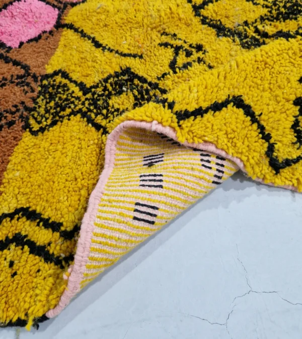 Detailed View of Handwoven tribal wool rug with an abstract color-block pattern