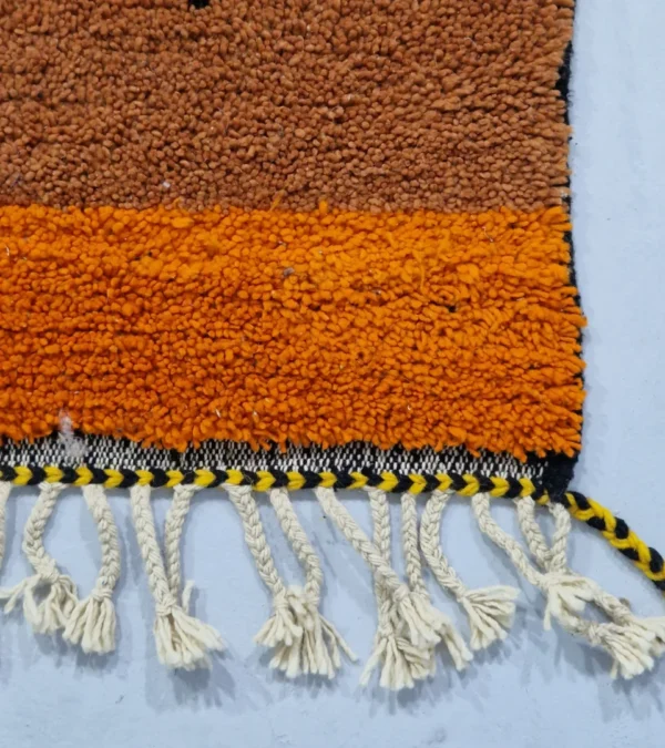 Detailed View of Handwoven tribal wool rug with an abstract color-block pattern