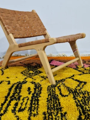 Colorful Handwoven tribal wool rug with an abstract color-block pattern in room