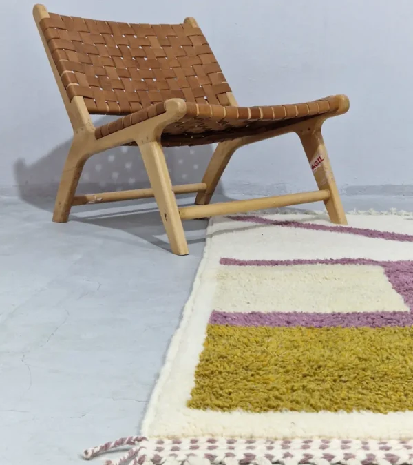 Off-White and Purple Curve Abstract Wool Rug Styled in a wall decorated room
