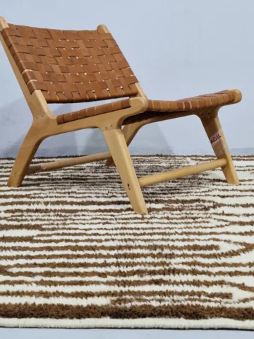 Brown and Ivory Handwoven wool rug with a bold stripe and tribal pattern for indoor/outdoor use