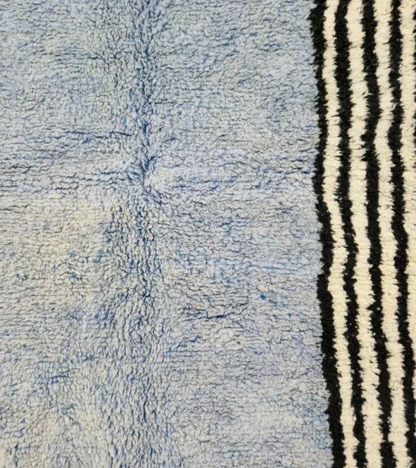 Detailed View of Handmade Moroccan wool rug with a minimalist block and stripe design in blue, black, and white