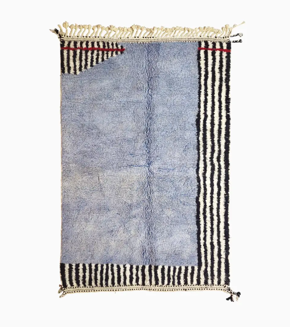 Top View of Handmade Moroccan wool rug with a minimalist block and stripe design in blue, black, and white