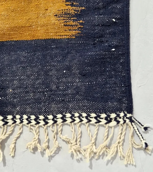 Detailed View of Alice handmade Kilim flatweave rug with a boho geometric design in navy, yellow, brown, and white