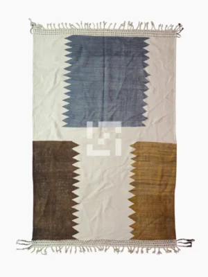 Top View of Aline handmade Beni Ourain flatweave rug with a modern jagged pattern in blue, brown, and ivory