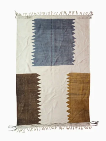 Top View of Aline handmade Beni Ourain flatweave rug with a modern jagged pattern in blue, brown, and ivory