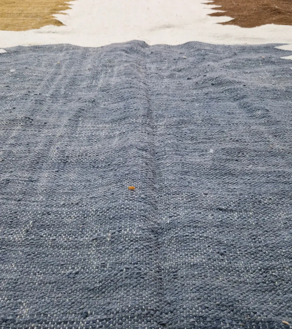 Detailed View of Aline handmade Beni Ourain flatweave rug with a modern jagged pattern in blue, brown, and ivory