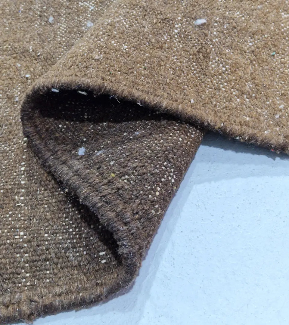 Detailed View of Aline handmade Beni Ourain flatweave rug with a modern jagged pattern in blue, brown, and ivory