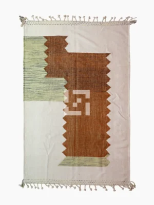 Top View of Aline handmade Kilim flatweave rug with a sawtooth pattern in brown, light green, and ivory