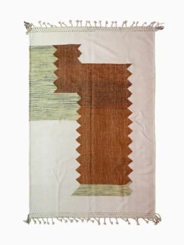 Top View of Aline handmade Kilim flatweave rug with a sawtooth pattern in brown, light green, and ivory