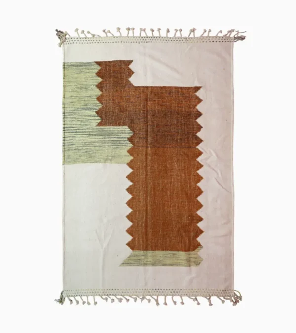 Top View of Aline handmade Kilim flatweave rug with a sawtooth pattern in brown, light green, and ivory