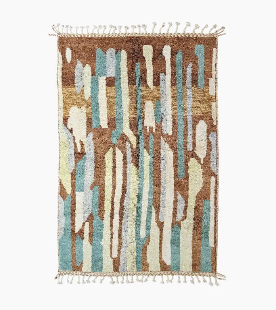 Top View of Handmade Moroccan wool rug with an abstract brushstroke design in cream, beige, blue, and yellow on a brown background