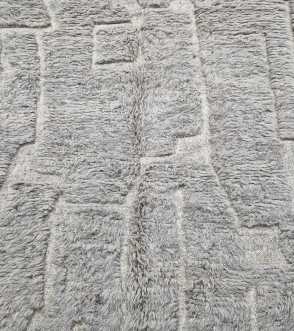Detailed View of Anis handmade Beni Ourain wool rug with an abstract map-like design in textured taupe and ivory