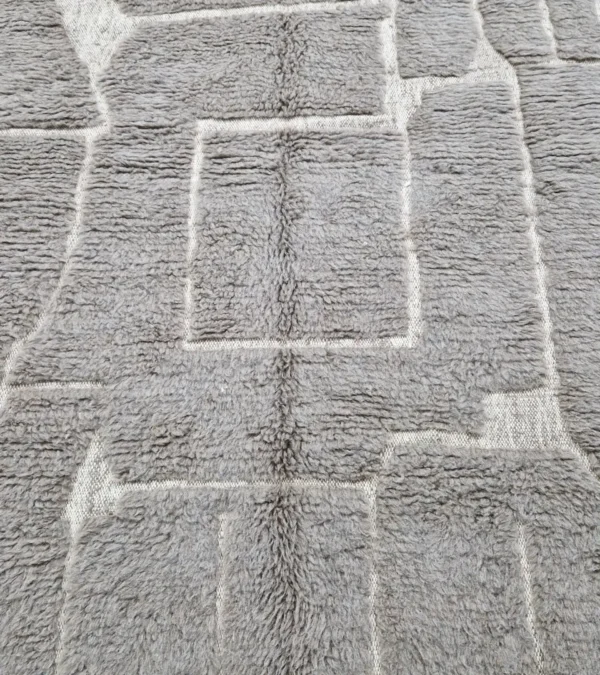 Detailed View of Anis handmade Beni Ourain wool rug with a subtle abstract geometric design in textured taupe and ivory