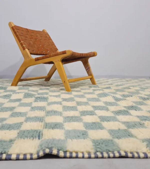 Aura handmade Beni Ourain wool rug with a modern blue and ivory checkerboard design in room