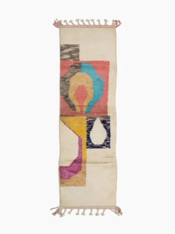 Top View of Avery handmade Azilal wool runner with a mid-century abstract design in coral, yellow, blue, and black