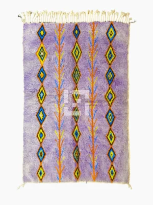 Top View of Handmade Moroccan wool rug with a diamond trellis pattern in yellow, blue, and orange on lavender