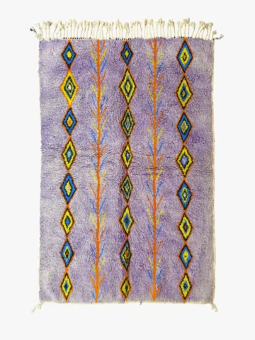 Top View of Handmade Moroccan wool rug with a diamond trellis pattern in yellow, blue, and orange on lavender