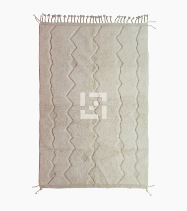 Top View of Berry handmade Beni Mrirt wool rug with a subtle raised geometric pattern on an ivory background