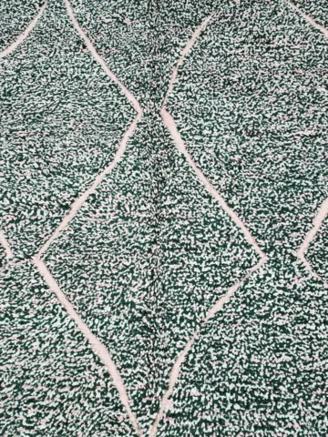 Detailed View of Handmade Moroccan wool rug with a high/low pile and a green textured lattice pattern