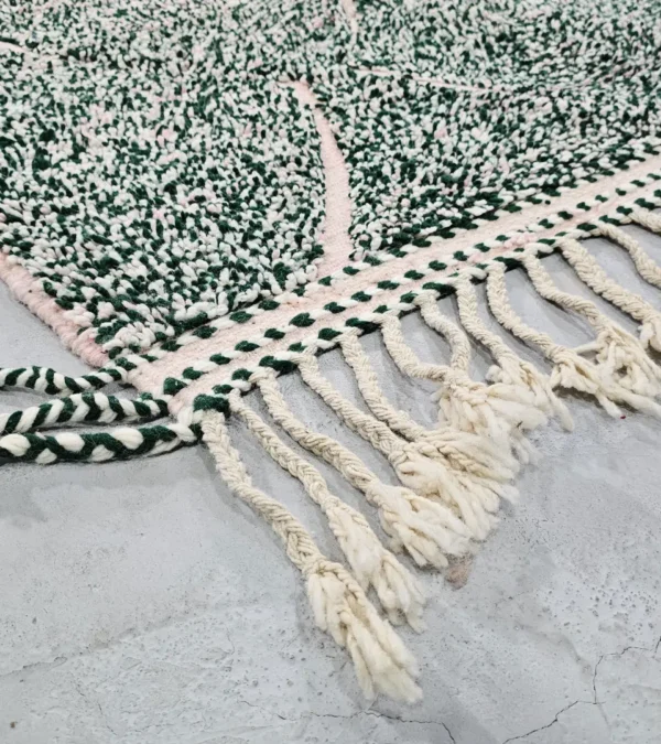 Detailed View of Handmade Moroccan wool rug with a high/low pile and a green textured lattice pattern