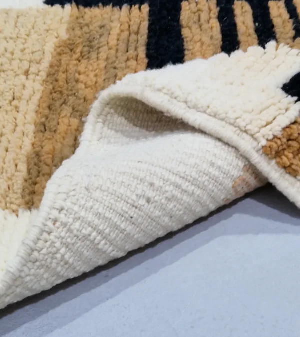 Detailed View of Brann handmade Beni Ourain wool runner with a striped and block design in black, beige, and ivory