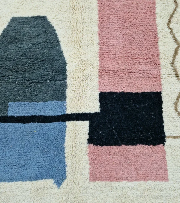 Detailed View of Handmade Moroccan wool rug with a Mid-Century abstract design in teal, brown, pink, and black