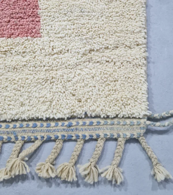Detailed View of Handmade Moroccan wool rug with a Mid-Century abstract design in teal, brown, pink, and black