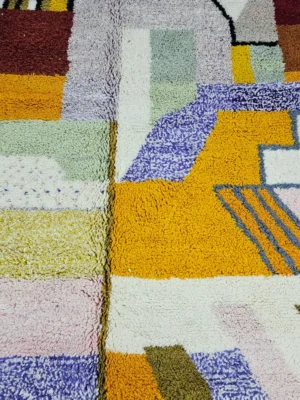 Detailed View of Handmade Azilal wool rug with a vibrant and complex abstract geometric design in multiple colors