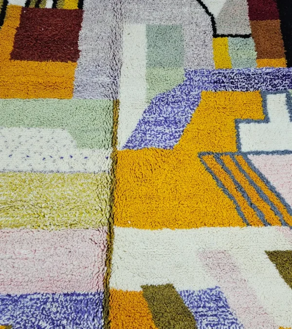 Detailed View of Handmade Azilal wool rug with a vibrant and complex abstract geometric design in multiple colors