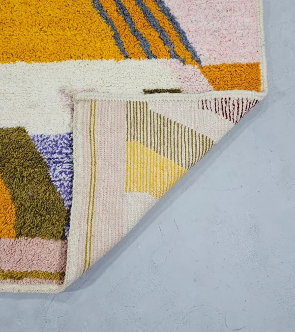 Detailed View of Handmade Azilal wool rug with a vibrant and complex abstract geometric design in multiple colors