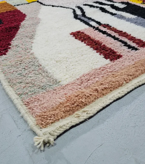 Detailed View of Handmade Azilal wool rug with a vibrant and complex abstract geometric design in multiple colors