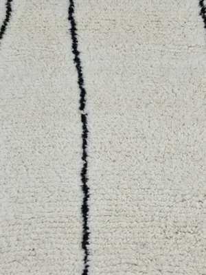 Detailed View of Cora handmade Beni Ourain wool runner with a minimalist striped design in black and ivory