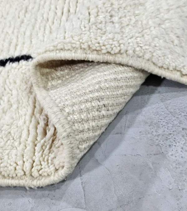 Detailed View of Cora handmade Beni Ourain wool runner with a minimalist striped design in black and ivory