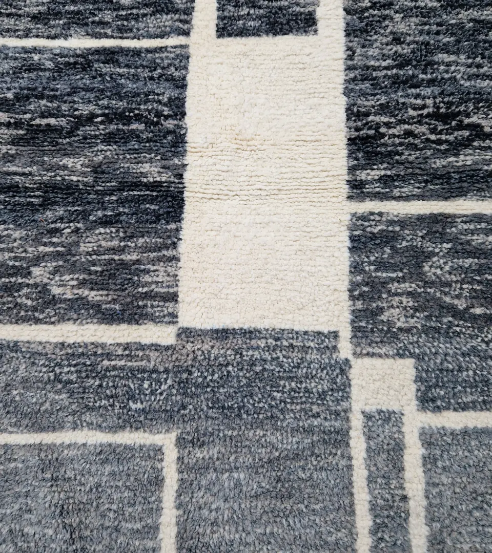Detailed View of Cora handmade Beni Mrirt wool rug with a modern textured pattern in charcoal gray and ivory