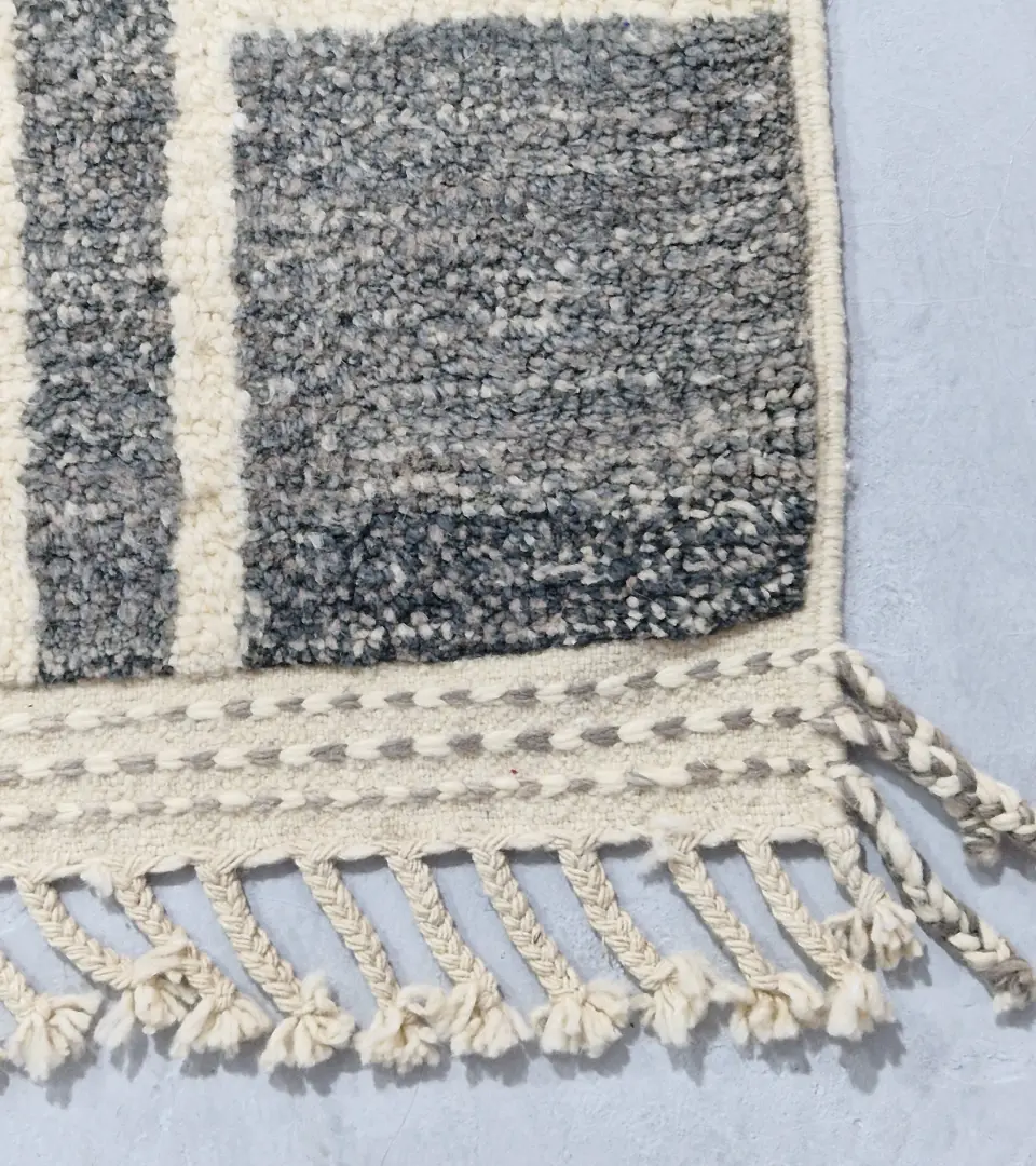 Detailed View of Cora handmade Beni Mrirt wool rug with a modern textured pattern in charcoal gray and ivory