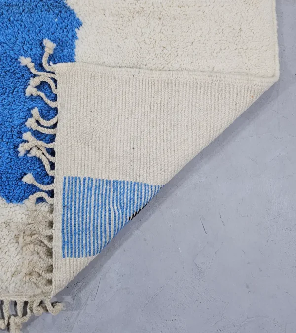 Detailed View of Diana handmade Beni Ourain wool rug with a contemporary abstract design in blues, grays, black, and green