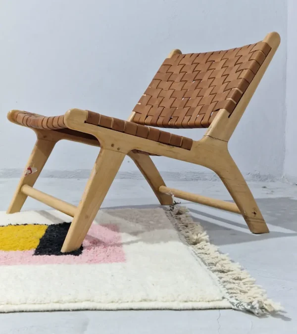Elara handmade Beni Ourain wool rug with a colorful block design in vibrant pink, mustard yellow, and charcoal gray in room